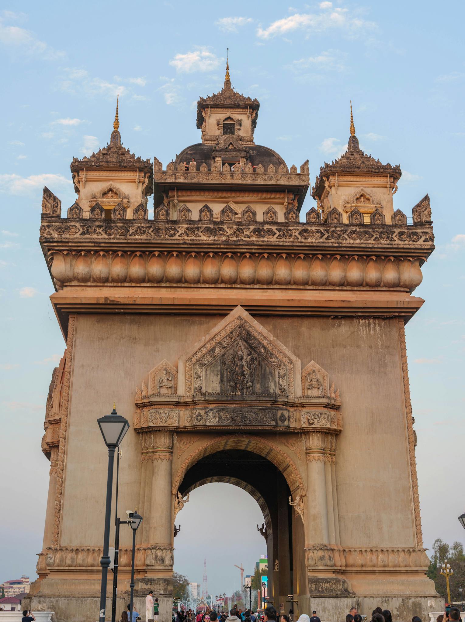 View of Patuxai Monument, an iconic landmark in Vientiane, Laos, standing majestically under a clear sky.